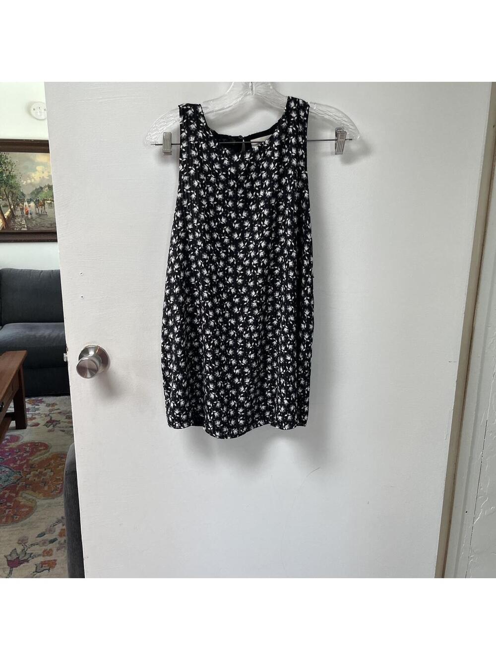 Black and white floral sleeveless top. New with tags.